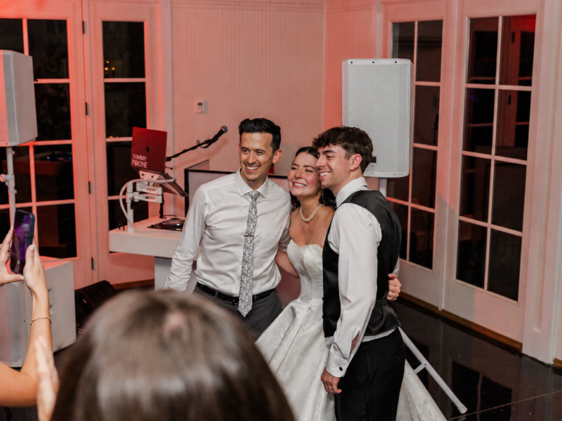 DJ Tommy Pirone with bride and groom - Little River Farms wedding DJ Tommy Pirone posing with the bride and groom by the DJ booth at their Little River Farms wedding in Alpharetta GA